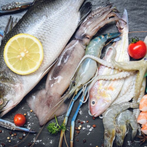 seafood-plate-with-shellfish-shrimps-prawns-crab-shell-cockles-mussel-squid-octopus-fish_73523-562